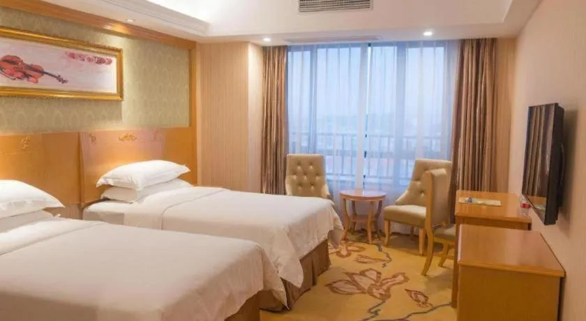 Bed in Vienna Hotel Guangxi Guilin Xing'an