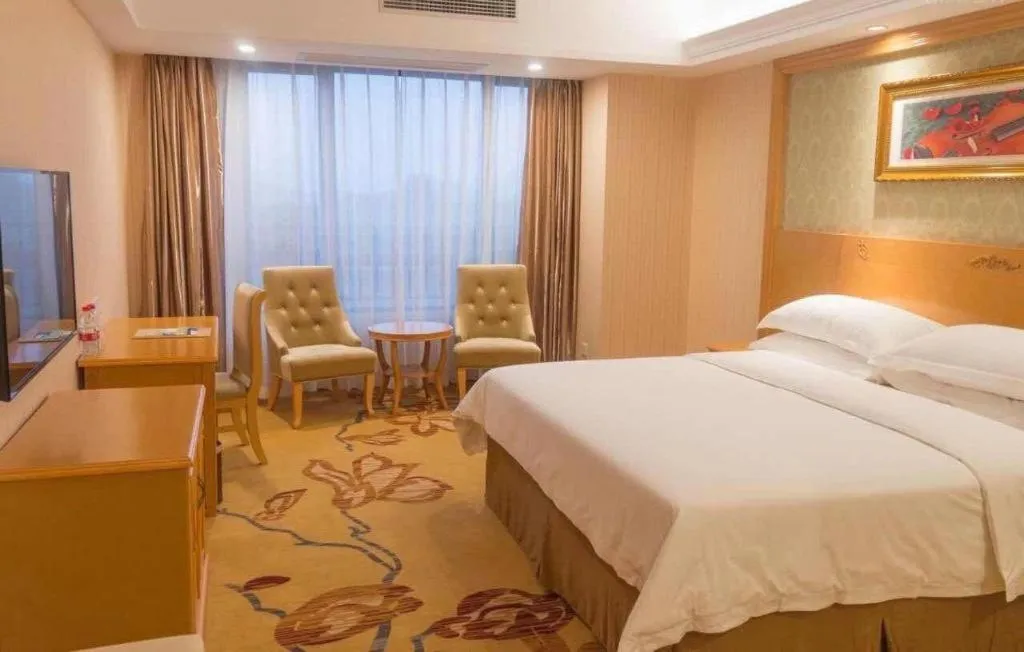 Bed in Vienna Hotel Guangxi Guilin Xing'an