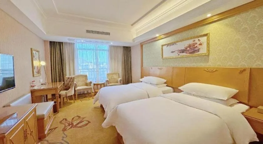 Bed in Vienna Hotel Guangxi Guilin Xing'an