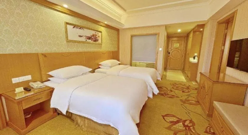 Bed in Vienna Hotel Guangxi Guilin Xing'an