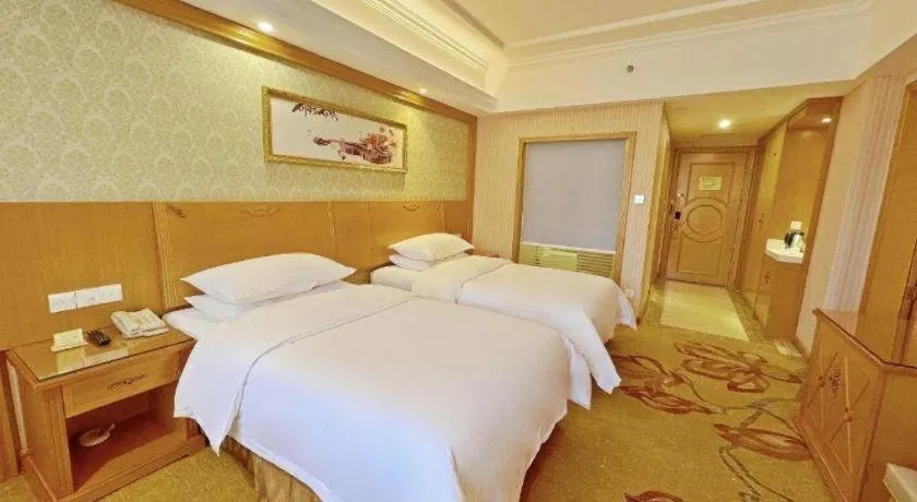 Bed in Vienna Hotel Guangxi Guilin Xing'an