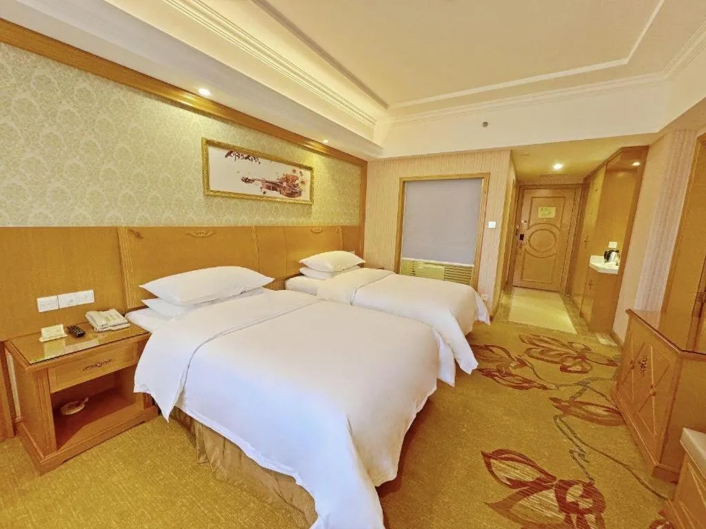 Bed in Vienna Hotel Guangxi Guilin Xing'an