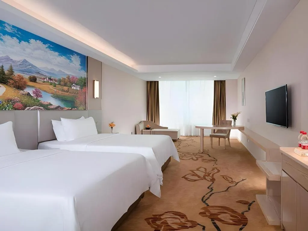Bed in Vienna Hotel Guangdong Huizhou High-Speed North Railway Station Xiaojinkou