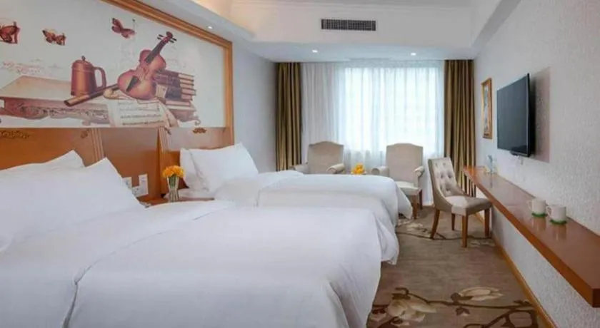 Bed in Vienna Hotel Guangdong Huizhou High-Speed North Railway Station Xiaojinkou