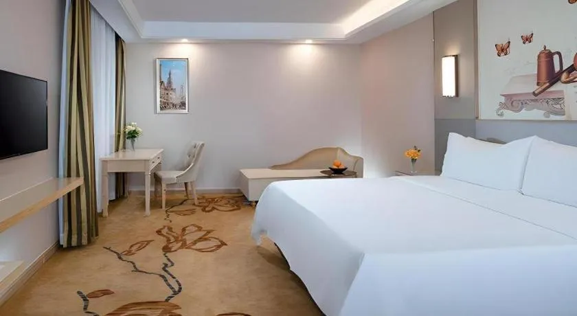Bed in Vienna Hotel Guangdong Huizhou High-Speed North Railway Station Xiaojinkou