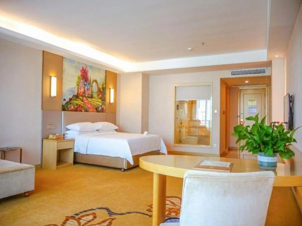 Bed in Vienna Hotel Guangdong Huizhou High-Speed North Railway Station Xiaojinkou