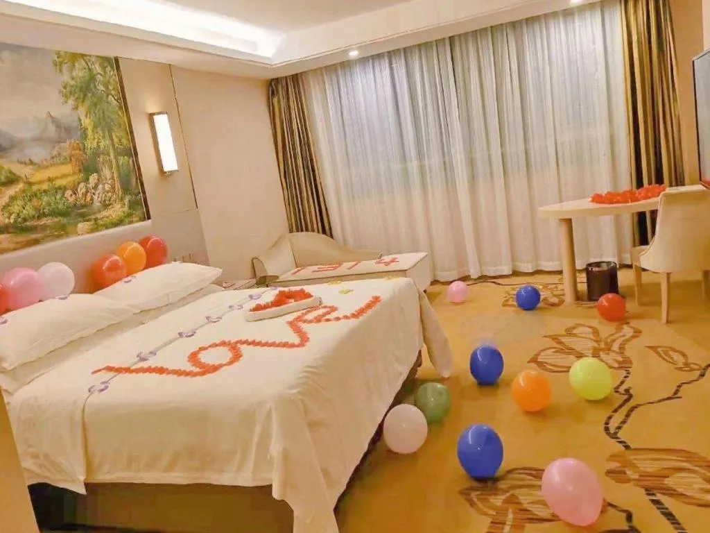 Bed in Vienna Hotel Guangdong Huizhou High-Speed North Railway Station Xiaojinkou