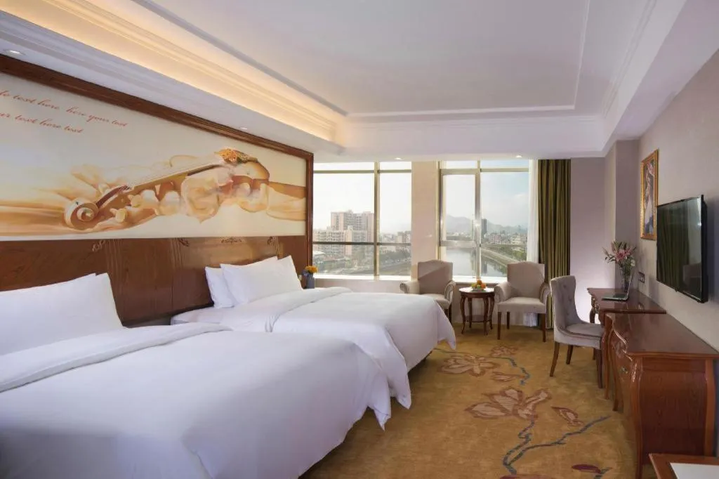 Bed in Vienna Hotel Guangdong Huizhou High-Speed North Railway Station Xiaojinkou
