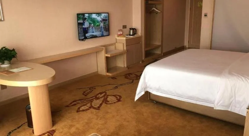 Bed in Vienna Hotel Guangdong Huizhou High-Speed North Railway Station Xiaojinkou