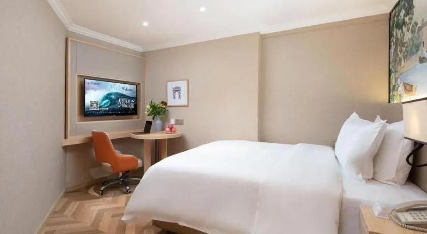 Bed in Vienna Hotel Yongzhou Dong'an High-Speed Railway Station