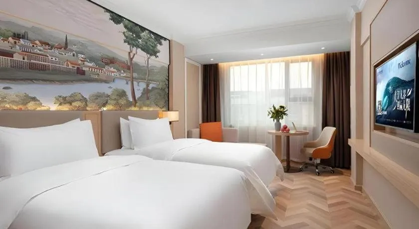 Bed in Vienna Hotel Yongzhou Dong'an High-Speed Railway Station