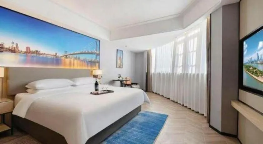 Bed in Vienna Hotel Yongzhou Dong'an High-Speed Railway Station