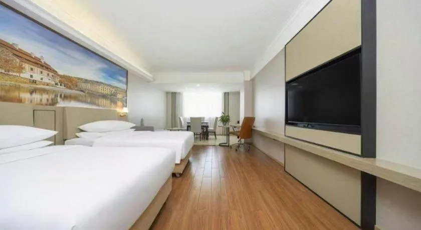 Bed in Vienna Hotel Yongzhou Dong'an High-Speed Railway Station