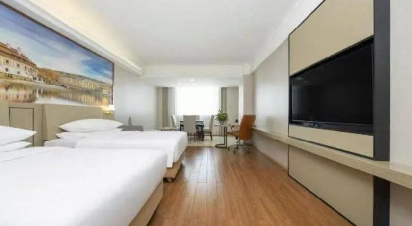 Bed in Vienna Hotel Yongzhou Dong'an High-Speed Railway Station