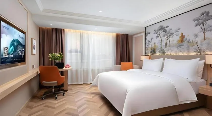 Bed in Vienna Hotel Yongzhou Dong'an High-Speed Railway Station