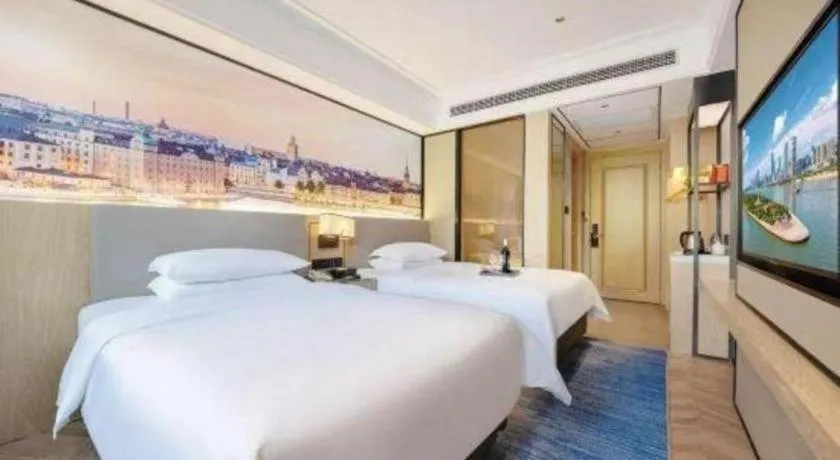 Bed in Vienna Hotel Yongzhou Dong'an High-Speed Railway Station