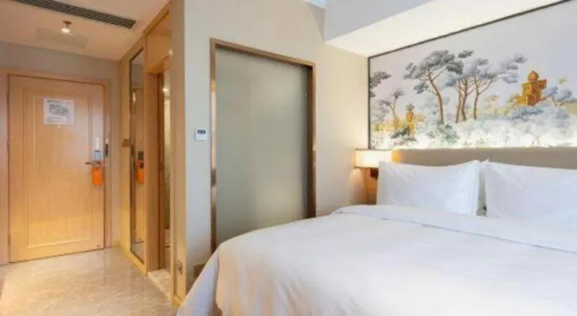 Bed in Vienna Hotel Yongzhou Dong'an High-Speed Railway Station