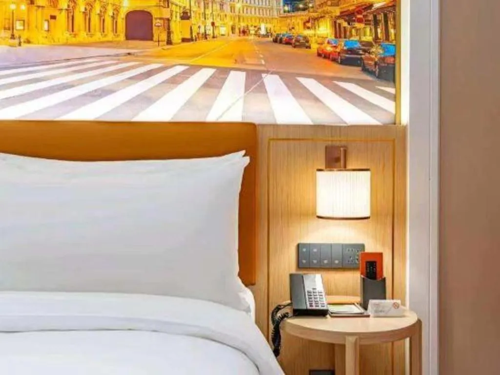 Bed in Vienna Hotel Yongzhou Dong'an High-Speed Railway Station