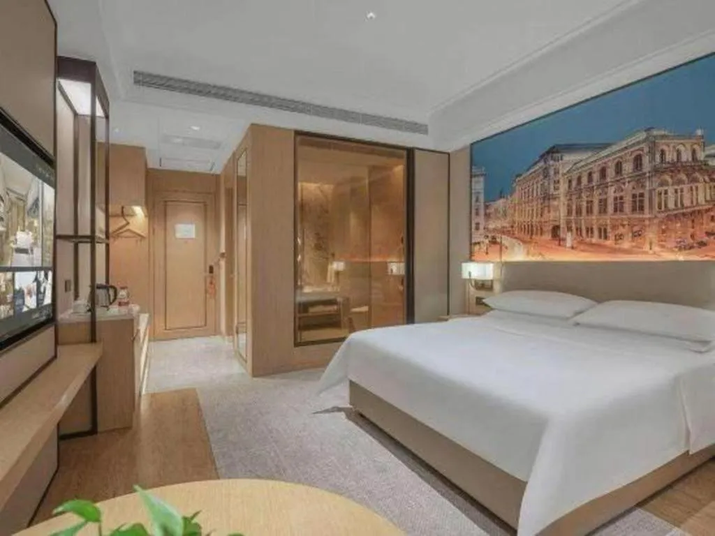 Bed in Vienna Hotel Yongzhou Dong'an High-Speed Railway Station