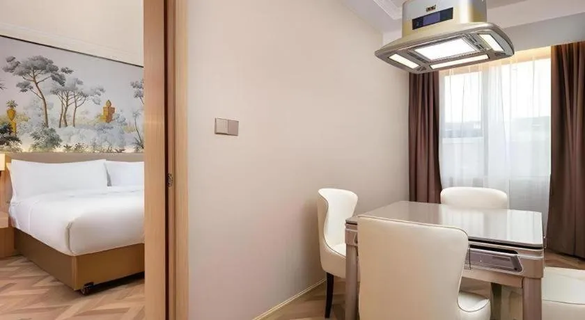 Bed in Vienna Hotel Yongzhou Dong'an High-Speed Railway Station