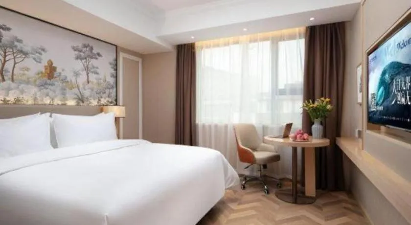 Bed in Vienna Hotel Yongzhou Dong'an High-Speed Railway Station