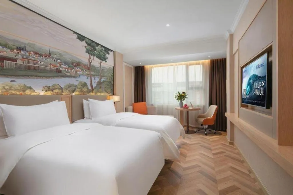 Bed in Vienna Hotel Yongzhou Dong'an High-Speed Railway Station