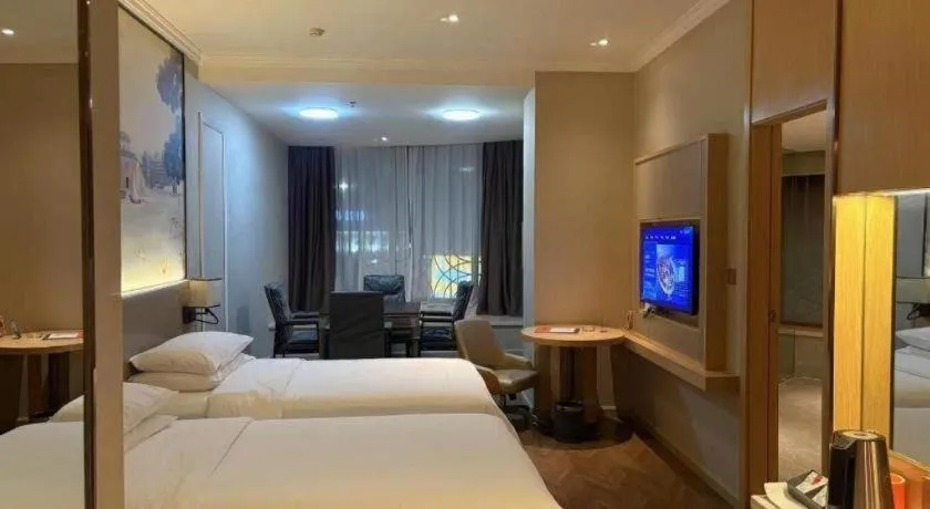 Bed in Vienna Hotel Yongzhou Dong'an High-Speed Railway Station