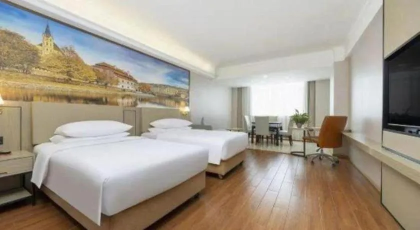 Bed in Vienna Hotel Yongzhou Dong'an High-Speed Railway Station