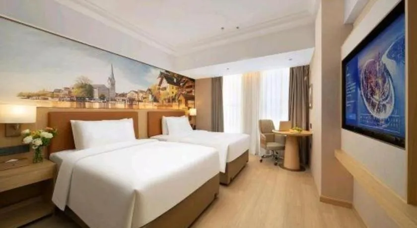 Bed in Vienna Hotel Yongzhou Dong'an High-Speed Railway Station