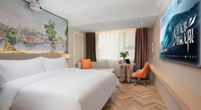 Bed in Vienna Hotel Yongzhou Dong'an High-Speed Railway Station