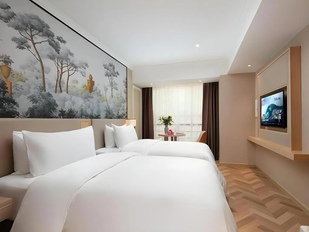 Bed in Vienna Hotel Yongzhou Dong'an High-Speed Railway Station