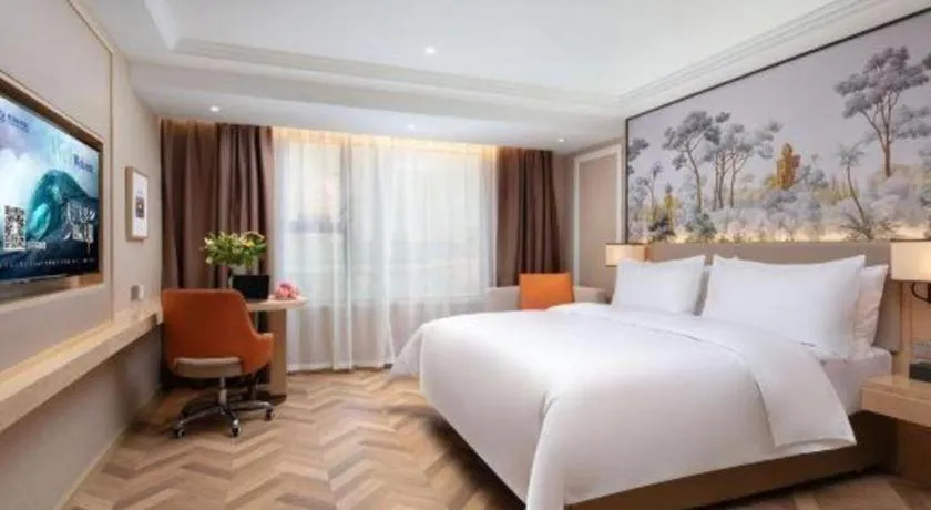 Bed in Vienna Hotel Yongzhou Dong'an High-Speed Railway Station