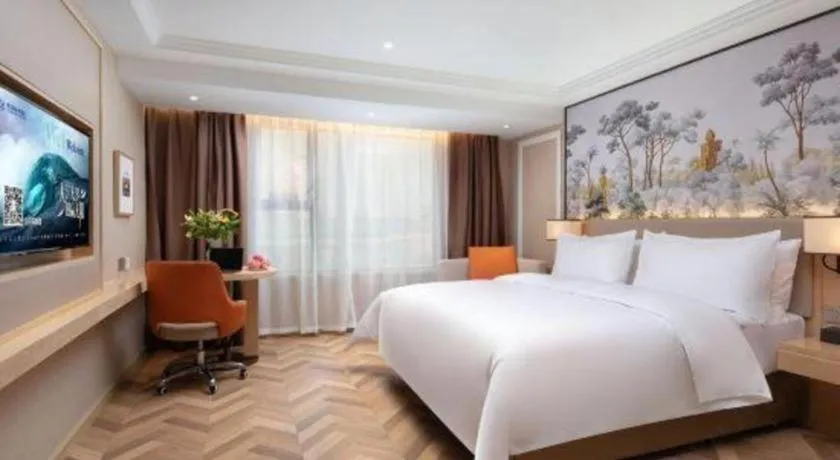 Bed in Vienna Hotel Yongzhou Dong'an High-Speed Railway Station