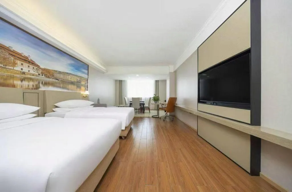 Bed in Vienna Hotel Yongzhou Dong'an High-Speed Railway Station