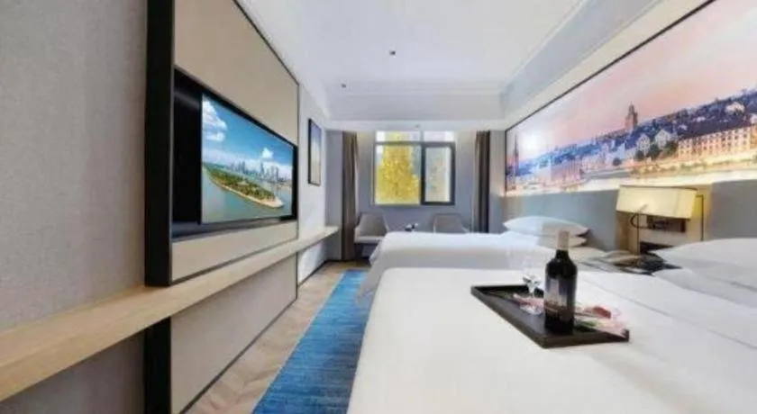 Bed in Vienna Hotel Yongzhou Dong'an High-Speed Railway Station