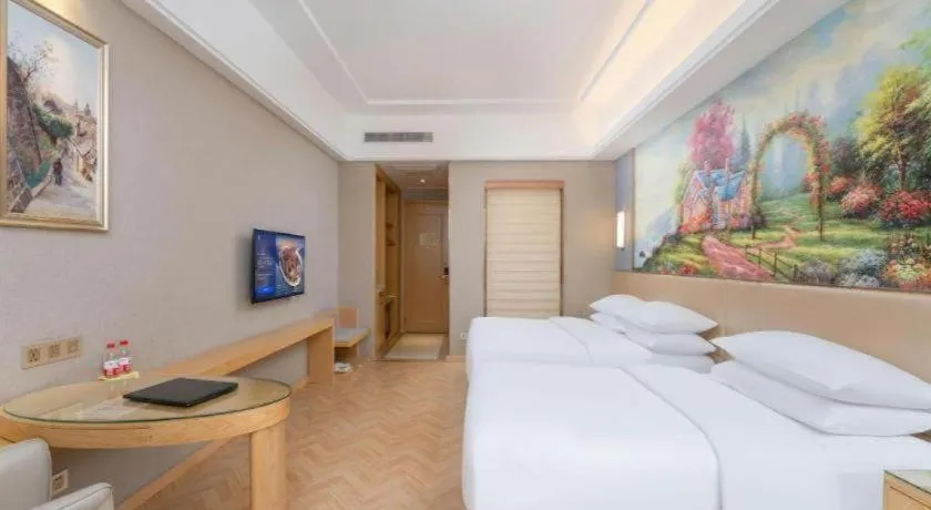 Bed in Vienna Hotel Jiangsu Zhangjiagang Passenger Terminal Station