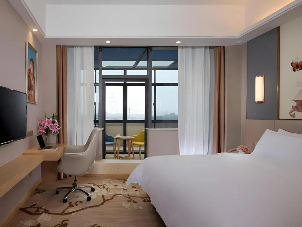 Bed in Vienna Hotel Jiangsu Zhangjiagang Passenger Terminal Station