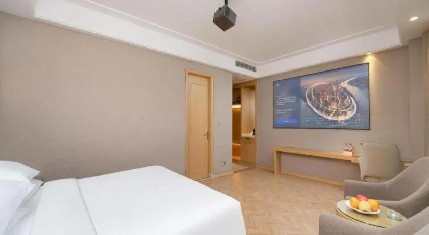 Bed in Vienna Hotel Jiangsu Zhangjiagang Passenger Terminal Station