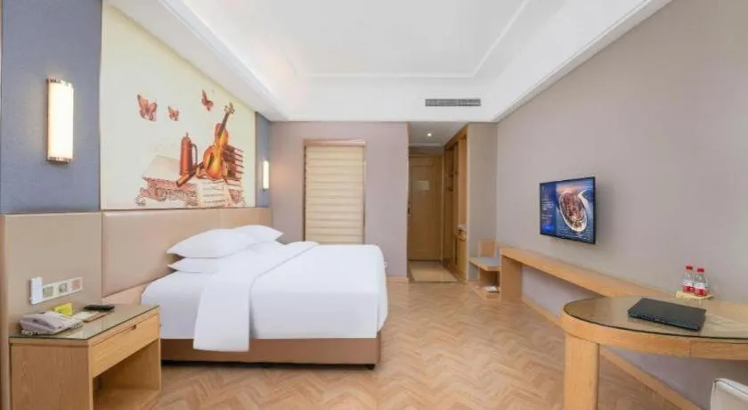 Bed in Vienna Hotel Jiangsu Zhangjiagang Passenger Terminal Station