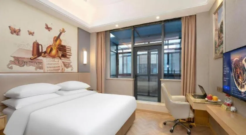 Bed in Vienna Hotel Jiangsu Zhangjiagang Passenger Terminal Station