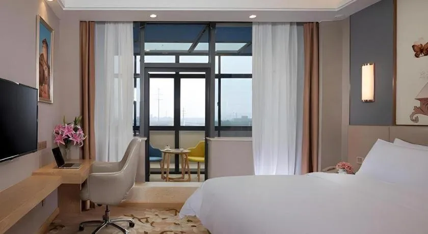 Bed in Vienna Hotel Jiangsu Zhangjiagang Passenger Terminal Station