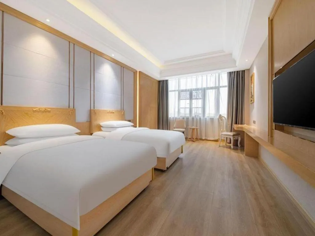 Bed in Vienna Hotel Jiangsu Kunshan Qiandeng Town