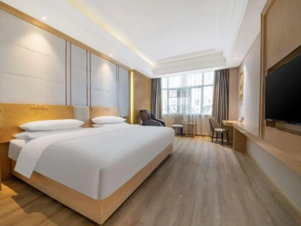 Bed in Vienna Hotel Jiangsu Kunshan Qiandeng Town