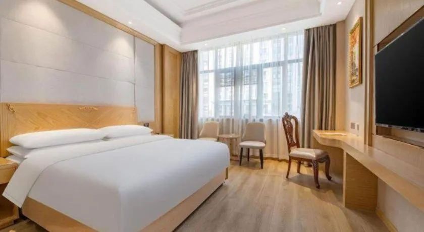 Bed in Vienna Hotel Jiangsu Kunshan Qiandeng Town