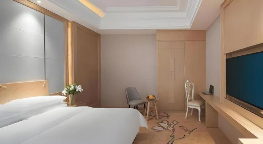 Bed in Vienna Hotel Jiangsu Kunshan Qiandeng Town