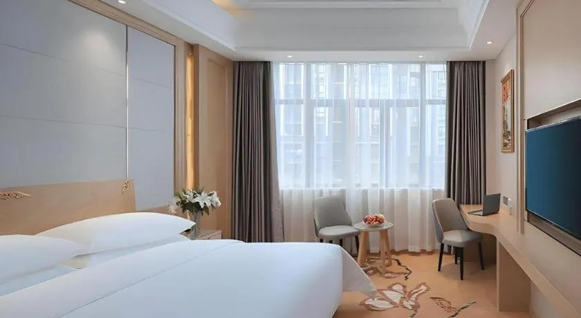 Bed in Vienna Hotel Jiangsu Kunshan Qiandeng Town