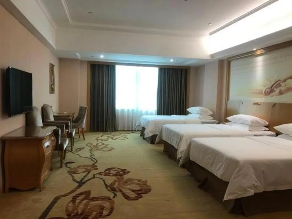 Bed in Vienna Hotel Guangzhou Huadu Sunac Cultural Tourism City Shiling