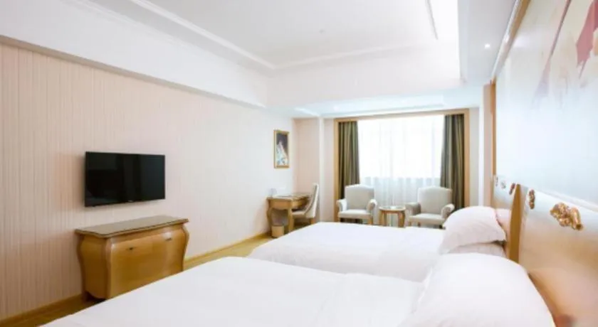 Bed in Vienna Hotel Guangzhou Huadu Sunac Cultural Tourism City Shiling