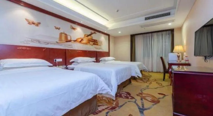 Bed in Vienna Hotel Guangzhou Huadu Sunac Cultural Tourism City Shiling