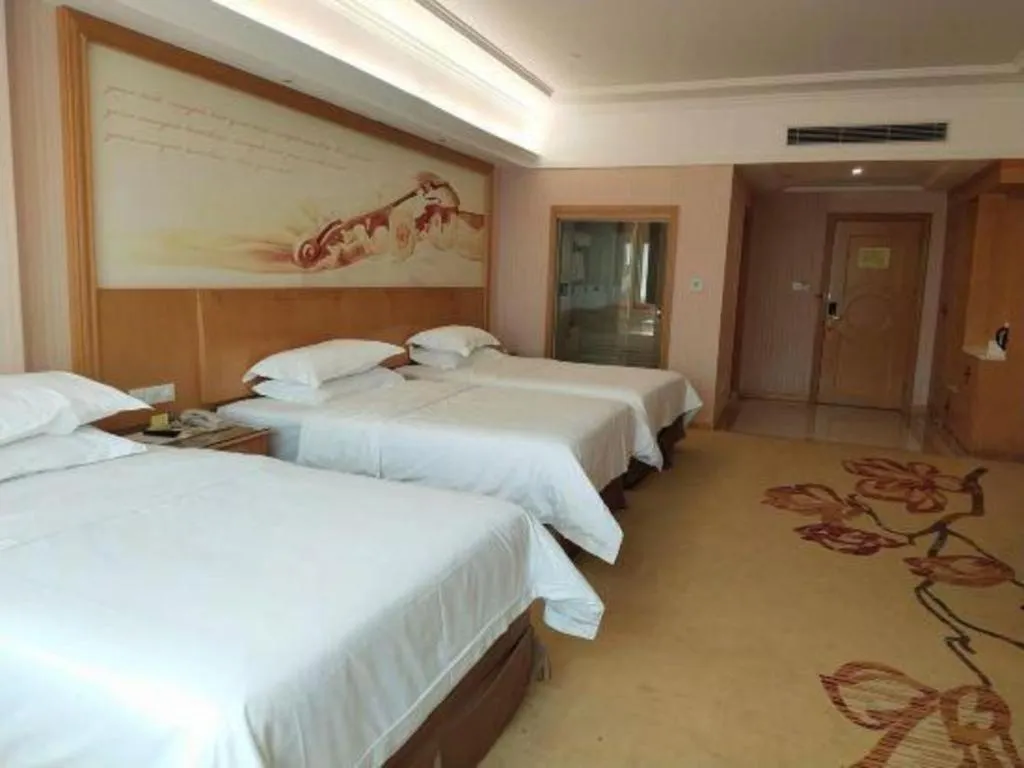 Bed in Vienna Hotel Guangzhou Huadu Sunac Cultural Tourism City Shiling